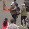 Runners help exhausted woman reach finish line in marathon