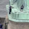 Woman protesting migrant separation climbs base of Statue of Liberty, booked