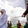Woman caned in front of jeering crowd in Indonesia for breaking Islamic law