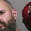 Macaw poses in man's mug shot after unlucky court appearance