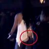 Video: Woman's butt implants pop out at concert, footage goes viral