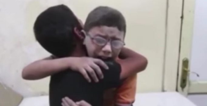 Heartbreaking video shows Syrian boys grieving death of brother killed in airstrike