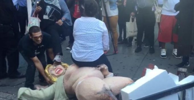 Video shows tussle over naked Hillary Clinton statue in NYC