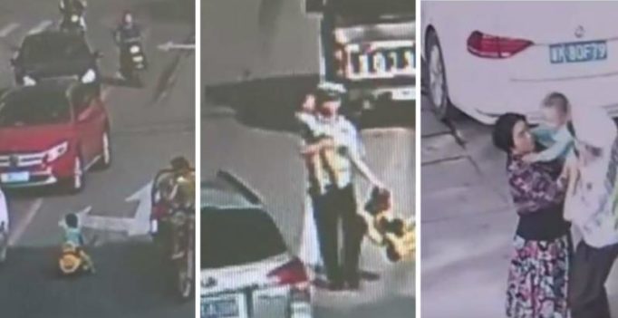 Video: Moment brave cop saves toddler driving toy car on busy street in China