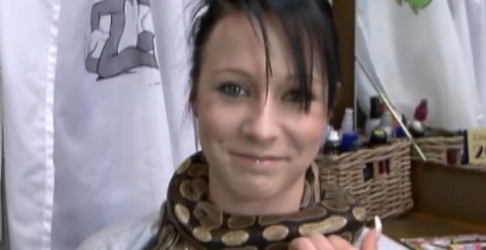 Video: Python gives neck massages to people
