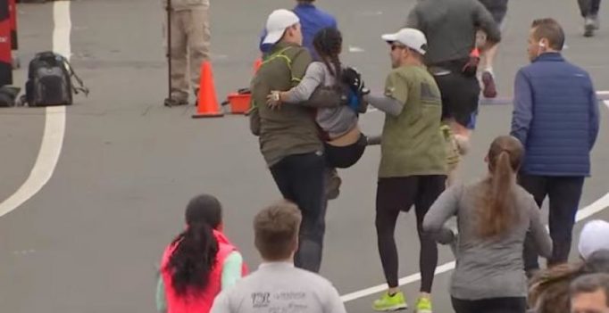 Runners help exhausted woman reach finish line in marathon